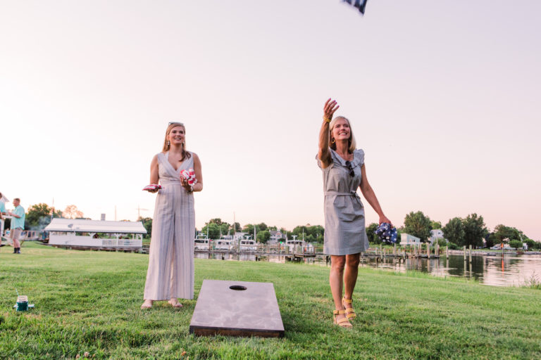 Wedding guest playing corn hole