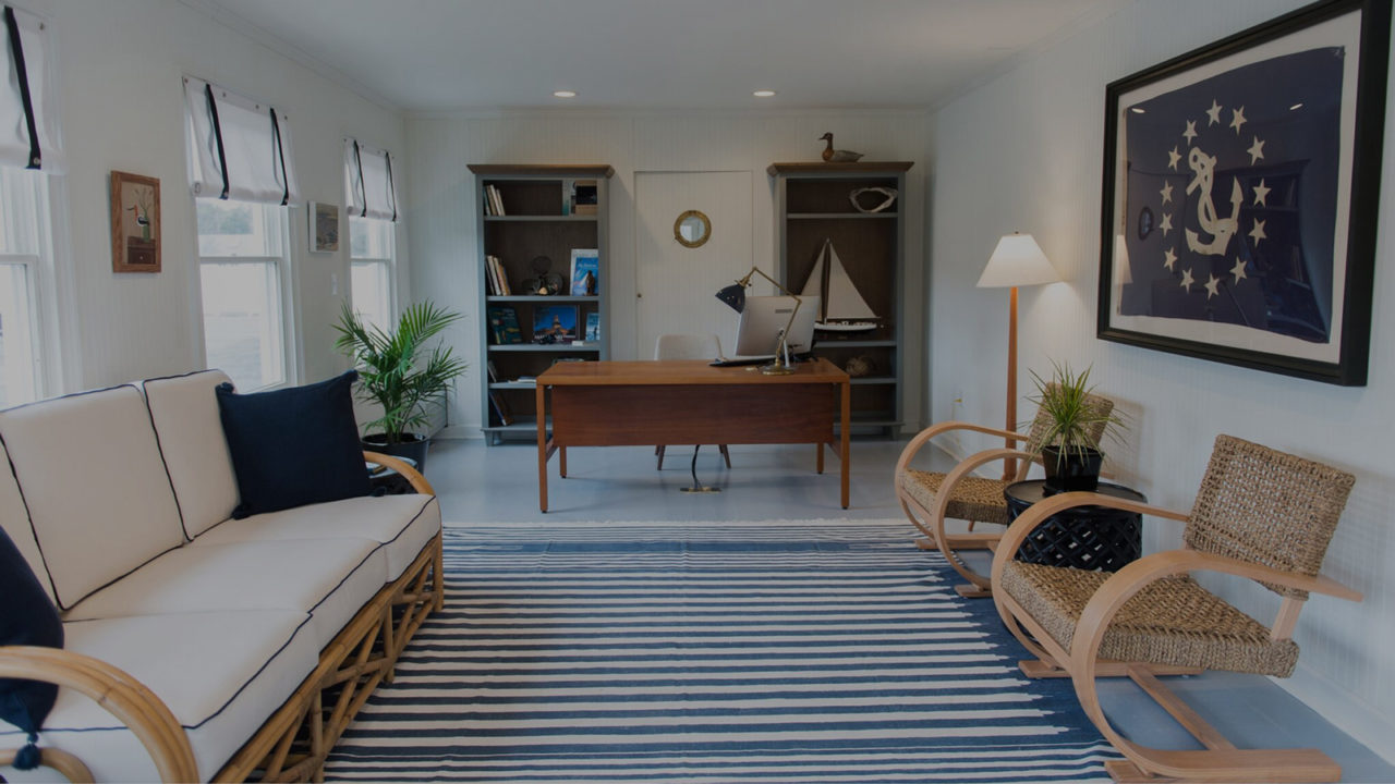 Room with a desk, seating area, and southern windows