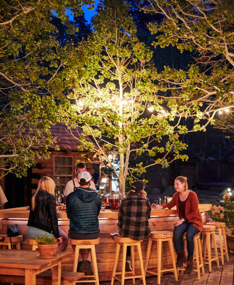 group of people sitting at outdoor bar
