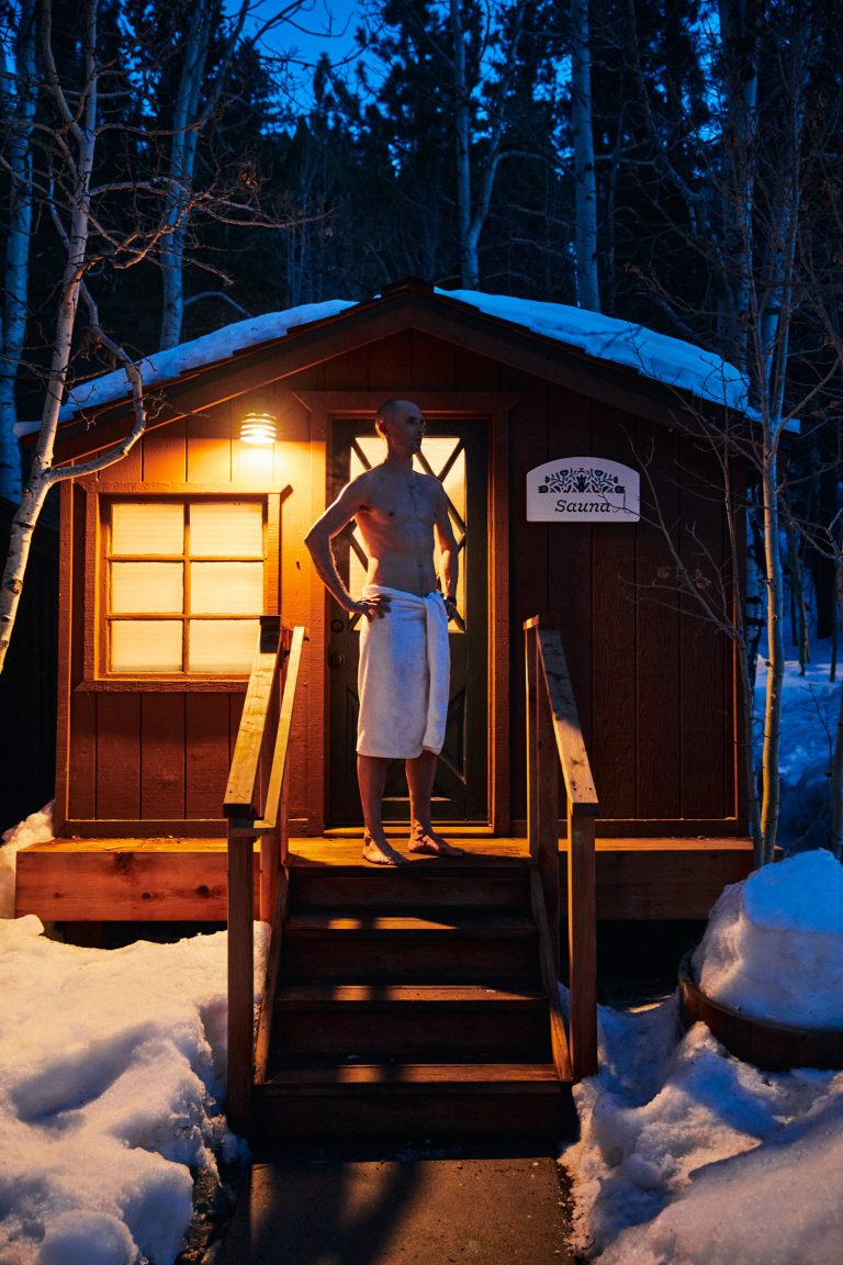 Person standing outside of sauna