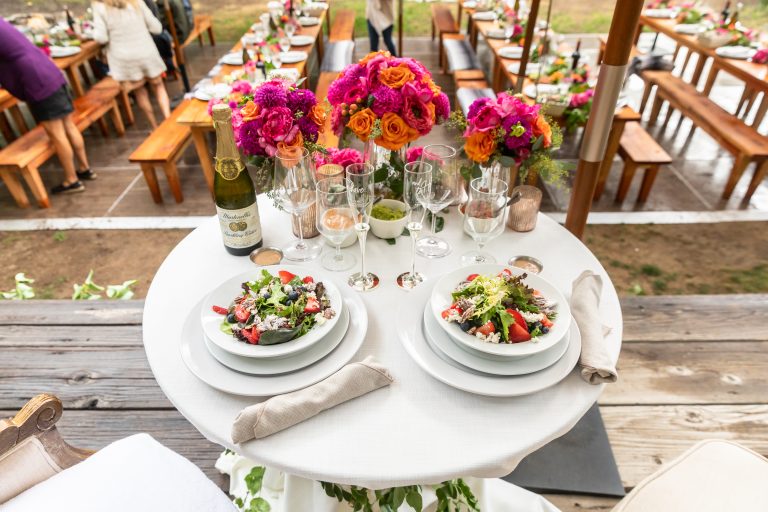 Flowers table with saldas and champagne