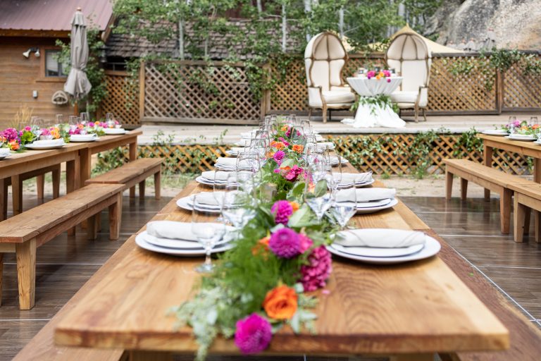 table for lots of guests and flowers