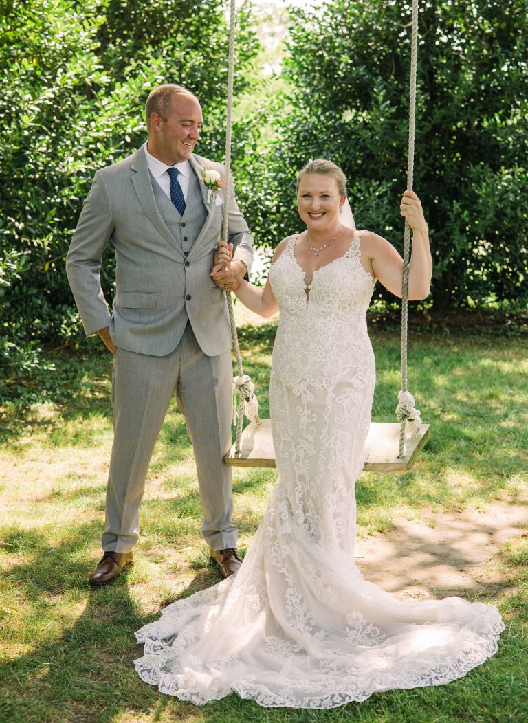 bride and groom at the swing
