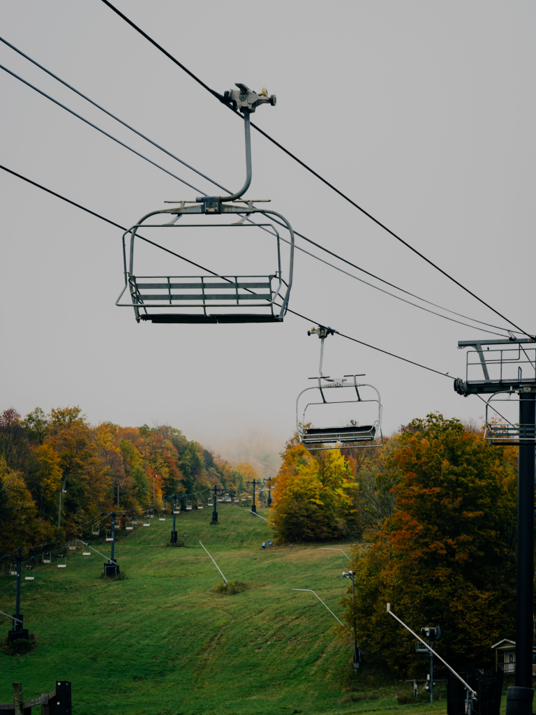 Chairlifts on a ski mountain during the fall.